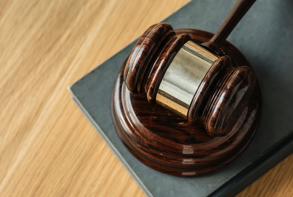 Image of a gavel resting on tabletop.